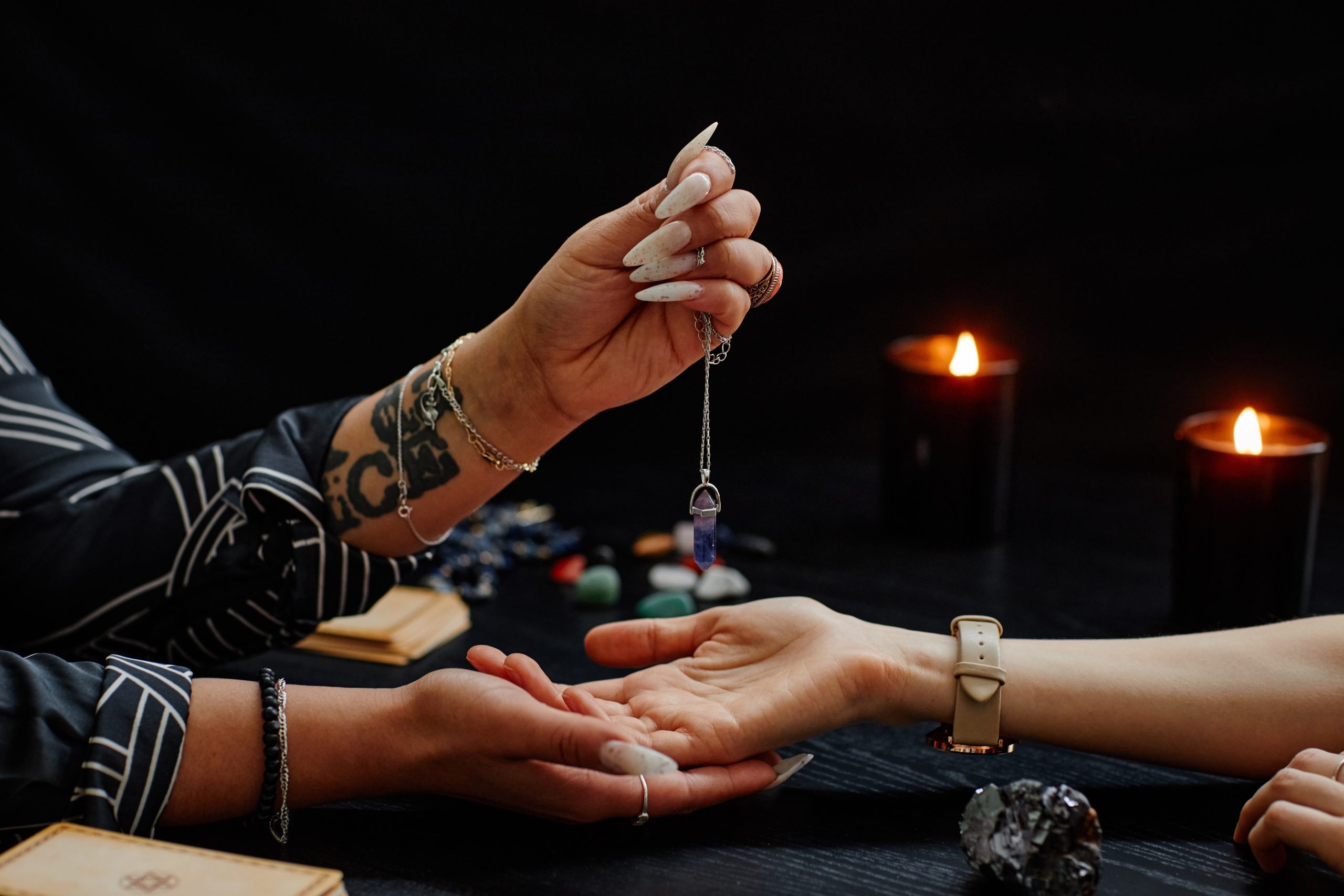 Close,Up,Of,Gypsy,Holding,Magic,Crystal,Over,Palm,Of